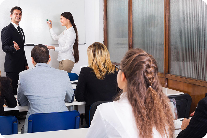 Instructor leading a learning workshop with engaged attendees