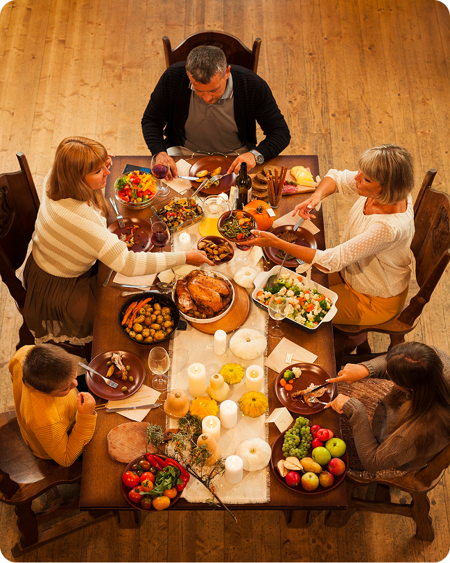 Family and friends sharing a Thanksgiving feast around the table